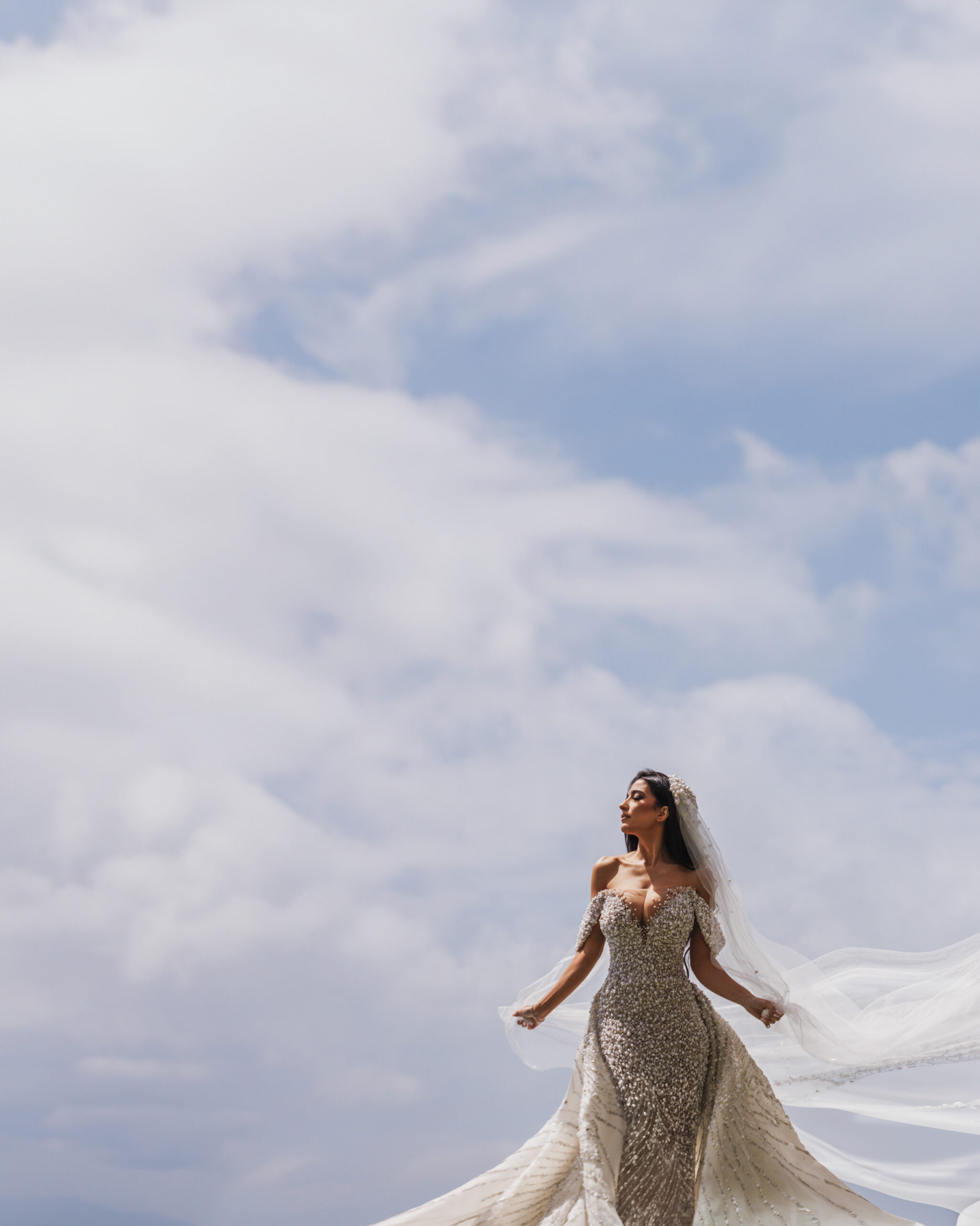 Bride-Portrait-Against-Dramatic-Sky-